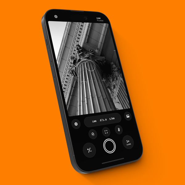 An iPhone 14 with Obscura’s camera interface over an orange background.