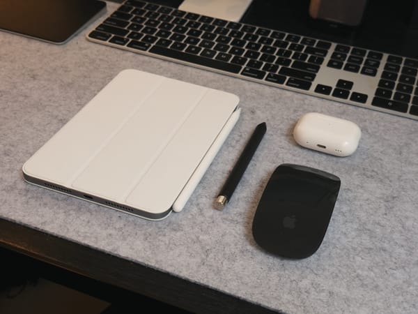 My new iPad mini, on my desk alongside a pen, mouse and AirPods case, for scale